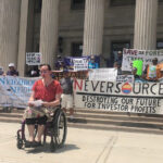 Demonstrators Take To City Hall Steps To Protest Planned Eversource